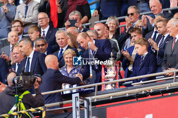 2024-05-25 - Erik ten Hag the Manchester United manager gets his winners medal from His Royal Highness the Prince of Wales after the English FA Cup, Final football match between Manchester City and Manchester United on 25 May 2024 at Wembley Stadium in London, England - FOOTBALL - ENGLISH CUP - FINAL - MANCHESTER CITY V MANCHESTER UNITED - ENGLISH LEAGUE CUP - SOCCER