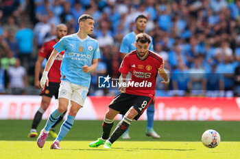 2024-05-25 - Phil Foden (47) of Manchester City and Bruno Fernandes (8) of Manchester United during the English FA Cup, Final football match between Manchester City and Manchester United on 25 May 2024 at Wembley Stadium in London, England - FOOTBALL - ENGLISH CUP - FINAL - MANCHESTER CITY V MANCHESTER UNITED - ENGLISH LEAGUE CUP - SOCCER