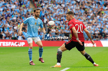 2024-05-25 - Bernardo Silva (20) of Manchester City and Diogo Dalot (20) of Manchester United during the English FA Cup, Final football match between Manchester City and Manchester United on 25 May 2024 at Wembley Stadium in London, England - FOOTBALL - ENGLISH CUP - FINAL - MANCHESTER CITY V MANCHESTER UNITED - ENGLISH LEAGUE CUP - SOCCER