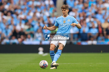 2024-05-25 - John Stones (5) of Manchester City during the English FA Cup, Final football match between Manchester City and Manchester United on 25 May 2024 at Wembley Stadium in London, England - FOOTBALL - ENGLISH CUP - FINAL - MANCHESTER CITY V MANCHESTER UNITED - ENGLISH LEAGUE CUP - SOCCER