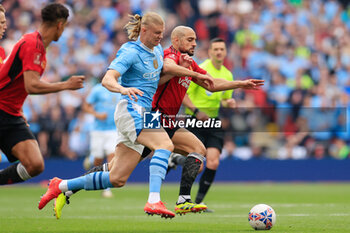 2024-05-25 - Erling Haaland (9) of Manchester City and Sofyan Amrabat (4) of Manchester United during the English FA Cup, Final football match between Manchester City and Manchester United on 25 May 2024 at Wembley Stadium in London, England - FOOTBALL - ENGLISH CUP - FINAL - MANCHESTER CITY V MANCHESTER UNITED - ENGLISH LEAGUE CUP - SOCCER