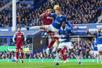 2024-01-14 - Aston Villa forward Ollie Watkins (11) challenges in the air with Everton defender Vitaliy Mykolenko (19) during the English championship Premier League football match between Everton and Aston Villa on 14 January 2024 at Goodison Park in Liverpool, England - FOOTBALL - ENGLISH CHAMP - EVERTON V ASTON VILLA - ENGLISH PREMIER LEAGUE - SOCCER