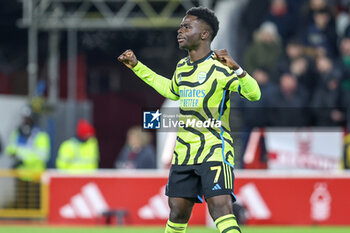 2024-01-30 - Bukayo Saka of Arsenal scores a goal and celebrates 0-2 during the English championship Premier League football match between Nottingham Forest and Arsenal on 30 January 2024 at the City Ground in Nottingham, England - FOOTBALL - ENGLISH CHAMP - NOTTINGHAM V ARSENAL - ENGLISH PREMIER LEAGUE - SOCCER