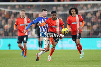 2024-01-30 - Luton Town Midfielder Chiedozie Ogbene (7) during the English championship Premier League football match between Luton Town and Brighton and Hove Albion on 30 January 2024 at Kenilworth Road in Luton, England - FOOTBALL - ENGLISH CHAMP - LUTON TOWN V BRIGHTON - ENGLISH PREMIER LEAGUE - SOCCER