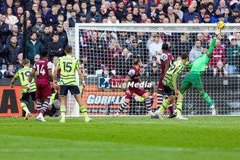 2024-02-12 - Alphonse Areola (23) of West Ham United saves a shot from Leandro Trossard (19) of Arsenal during the English championship Premier League football match between West Ham United and Arsenal on 11 February 2024 at the London Stadium in London, England - FOOTBALL - ENGLISH CHAMP - WEST HAM V ARSENAL - ENGLISH PREMIER LEAGUE - SOCCER