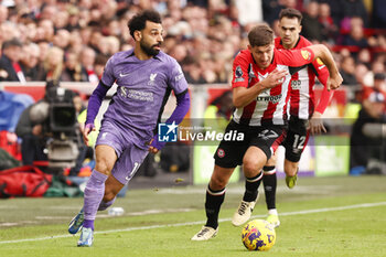 2024-02-17 - Mohamed Salah of Liverpool and Vitaly Janelt of Brentford during the English championship Premier League football match between Brentford and Liverpool on 17 February 2024 at Gtech Community Stadium in Brentford, England - FOOTBALL - ENGLISH CHAMP - BRENTFORD V LIVERPOOL - ENGLISH PREMIER LEAGUE - SOCCER