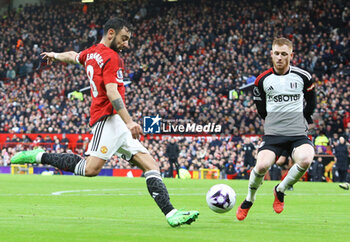 2024-02-24 - Manchester United Midfielder Bruno Fernandez (8) shoots during the English championship Premier League football match between Manchester United and Fulham on 24 February 2024 at Old Trafford in Manchester, England - FOOTBALL - ENGLISH CHAMP - MANCHESTER UNITED V FULHAM - ENGLISH PREMIER LEAGUE - SOCCER
