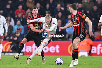 2024-02-24 - Erling Haaland (9) of Manchester City battles for possession with Marcos Senesi (25) of AFC Bournemouth during the English championship Premier League football match between Bournemouth and Manchester City on 24 February 2024 at the Vitality Stadium in Bournemouth, England - FOOTBALL - ENGLISH CHAMP - BOURNEMOUTH V MANCHESTER CITY - ENGLISH PREMIER LEAGUE - SOCCER