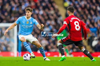 2024-03-04 - John Stones (5) of Manchester City during the English championship Premier League football match between Manchester City and Manchester United on 3 March 2024 at the Etihad Stadium in Manchester, England - FOOTBALL - ENGLISH CHAMP - MANCHESTER CITY V MANCHESTER UNITED - ENGLISH PREMIER LEAGUE - SOCCER