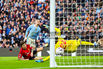 2024-03-04 - Phil Foden (47) of Manchester City scores a goal 2-1 during the English championship Premier League football match between Manchester City and Manchester United on 3 March 2024 at the Etihad Stadium in Manchester, England - FOOTBALL - ENGLISH CHAMP - MANCHESTER CITY V MANCHESTER UNITED - ENGLISH PREMIER LEAGUE - SOCCER