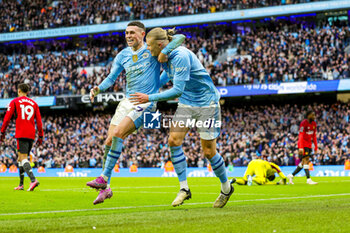 2024-03-04 - Erling Haaland (9) of Manchester City scores a goal and celebrates 3-1 with Phil Foden during the English championship Premier League football match between Manchester City and Manchester United on 3 March 2024 at the Etihad Stadium in Manchester, England - FOOTBALL - ENGLISH CHAMP - MANCHESTER CITY V MANCHESTER UNITED - ENGLISH PREMIER LEAGUE - SOCCER