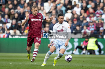2024-03-17 - West Ham United midfielder Tomas Soucek (28) battles with Aston Villa midfielder Morgan Rogers (27) during the English championship Premier League football match between West Ham United and Aston Villa on 17 March 2024 at the London Stadium in London, England - FOOTBALL - ENGLISH CHAMP - WEST HAM V ASTON VILLA - ENGLISH PREMIER LEAGUE - SOCCER