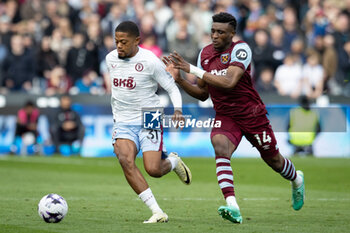 2024-03-17 - West Ham United midfielder Mohammed Kudus (14) battles with Aston Villa forward Leon Bailey (31) during the English championship Premier League football match between West Ham United and Aston Villa on 17 March 2024 at the London Stadium in London, England - FOOTBALL - ENGLISH CHAMP - WEST HAM V ASTON VILLA - ENGLISH PREMIER LEAGUE - SOCCER