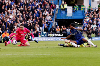 2024-03-30 - Arijanet Muric of Burnley saves from Raheem Sterling of Chelsea during the English championship Premier League football match between Chelsea and Burnley on 30 March 2024 at Stamford Bridge in London, England - FOOTBALL - ENGLISH CHAMP - CHELSEA V BURNLEY - ENGLISH PREMIER LEAGUE - SOCCER