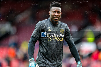 2024-04-07 - André Onana (24) of Manchester United warms up during the English championship Premier League football match between Manchester United and Liverpool on 7 April 2024 at Old Trafford in Manchester, England - FOOTBALL - ENGLISH CHAMP - MANCHESTER UNITED V LIVERPOOL - ENGLISH PREMIER LEAGUE - SOCCER