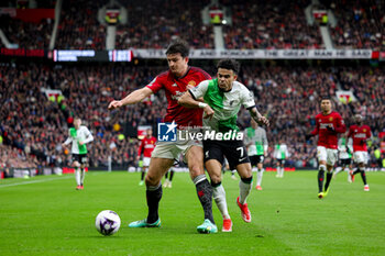 2024-04-07 - Harry Maguire (5) of Manchester United tussles with Luis Diaz (7) of Liverpool during the English championship Premier League football match between Manchester United and Liverpool on 7 April 2024 at Old Trafford in Manchester, England - FOOTBALL - ENGLISH CHAMP - MANCHESTER UNITED V LIVERPOOL - ENGLISH PREMIER LEAGUE - SOCCER
