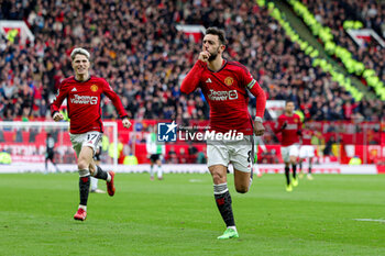 2024-04-07 - Bruno Fernandes (8) of Manchester United scores a goal and celebrates 1-1 during the English championship Premier League football match between Manchester United and Liverpool on 7 April 2024 at Old Trafford in Manchester, England - FOOTBALL - ENGLISH CHAMP - MANCHESTER UNITED V LIVERPOOL - ENGLISH PREMIER LEAGUE - SOCCER