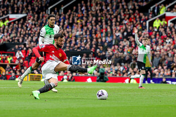 2024-04-07 - Bruno Fernandes (8) of Manchester United shoots during the English championship Premier League football match between Manchester United and Liverpool on 7 April 2024 at Old Trafford in Manchester, England - FOOTBALL - ENGLISH CHAMP - MANCHESTER UNITED V LIVERPOOL - ENGLISH PREMIER LEAGUE - SOCCER