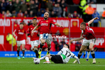 2024-04-07 - Curtis Jones (17) of Liverpool brings down Sofyan Amrabat (4) of Manchester United during the English championship Premier League football match between Manchester United and Liverpool on 7 April 2024 at Old Trafford in Manchester, England - FOOTBALL - ENGLISH CHAMP - MANCHESTER UNITED V LIVERPOOL - ENGLISH PREMIER LEAGUE - SOCCER
