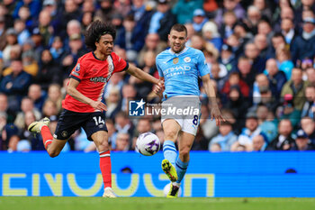 2024-04-13 - Mateo Kovacic (8) of Manchester City and Tahith Chong (14) of Luton Town during the English championship Premier League football match between Manchester City and Luton Town on 13 April 2024 at the Etihad Stadium in Manchester, England - FOOTBALL - ENGLISH CHAMP - MANCHESTER CITY V LUTON TOWN - ENGLISH PREMIER LEAGUE - SOCCER