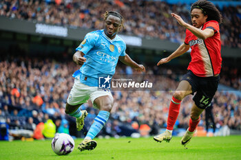 2024-04-13 - Jeremy Doku (11) of Manchester City and Tahith Chong (14) of Luton Town during the English championship Premier League football match between Manchester City and Luton Town on 13 April 2024 at the Etihad Stadium in Manchester, England - FOOTBALL - ENGLISH CHAMP - MANCHESTER CITY V LUTON TOWN - ENGLISH PREMIER LEAGUE - SOCCER