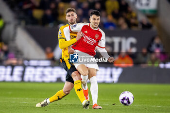 2024-04-20 - Arsenal defender Jakub Kiwior (15) and Santiago Bueno of Wolverhampton during the English championship Premier League football match between Wolverhampton Wanderers and Arsenal on 20 April 2024 at Molineux stadium in Wolverhampton, England - FOOTBALL - ENGLISH CHAMP - WOLVERHAMPTON V ARSENAL - ENGLISH PREMIER LEAGUE - SOCCER