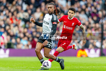 2024-04-21 - Fulham midfielder Alex Iwobi (22) and Liverpool forward Luis Diaz (7) during the English championship Premier League football match between Fulham and Liverpool on 21 April 2024 at Craven Cottage in London, England - FOOTBALL - ENGLISH CHAMP - FULHAM V LIVERPOOL - ENGLISH PREMIER LEAGUE - SOCCER