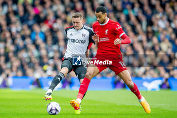 2024-04-21 - Fulham defender Timothy Castagne (21) battles with Liverpool forward Cody Gakpo (18) during the English championship Premier League football match between Fulham and Liverpool on 21 April 2024 at Craven Cottage in London, England - FOOTBALL - ENGLISH CHAMP - FULHAM V LIVERPOOL - ENGLISH PREMIER LEAGUE - SOCCER