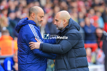2024-04-28 - Nuno Espírito Santo head coach of Nottingham Forest and Pep Guardiola manager of Manchester City greet each other during the English championship Premier League football match between Nottingham Forest and Manchester City on 28 April 2024 at the City Ground in Nottingham, England - FOOTBALL - ENGLISH CHAMP - NOTTINGHAM FOREST V MANCHESTER CITY - ENGLISH PREMIER LEAGUE - SOCCER