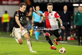 2024-02-15 - Quilindschy Hartman of Feyenoord is challenged by Edoardo Bove of AS Roma during the UEFA Europe League, Play-off 1st leg football match between Feyenoord and AS Roma on February 15, 2024 at Stadion Feijenoord in Rotterdam, Netherlands - FOOTBALL - EUROPA LEAGUE - FEYENOORD V ROMA - UEFA EUROPA LEAGUE - SOCCER