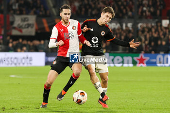 2024-02-15 - Ramiz Zerrouki of Feyenoord battles for the ball with Leonardo Spinazzola of AS Roma during the UEFA Europe League, Play-off 1st leg football match between Feyenoord and AS Roma on February 15, 2024 at Stadion Feijenoord in Rotterdam, Netherlands - FOOTBALL - EUROPA LEAGUE - FEYENOORD V ROMA - UEFA EUROPA LEAGUE - SOCCER