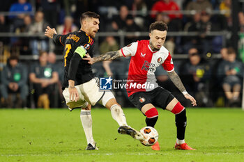 2024-02-15 - Quilindschy Hartman of Feyenoord is challenged by Lorenzo Pellegrini of AS Roma during the UEFA Europe League, Play-off 1st leg football match between Feyenoord and AS Roma on February 15, 2024 at Stadion Feijenoord in Rotterdam, Netherlands - FOOTBALL - EUROPA LEAGUE - FEYENOORD V ROMA - UEFA EUROPA LEAGUE - SOCCER