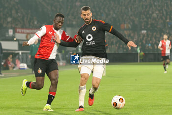 2024-02-15 - Yankuba Minteh of Feyenoord battles for the ball with Leonardo Spinazzola of AS Roma during the UEFA Europe League, Play-off 1st leg football match between Feyenoord and AS Roma on February 15, 2024 at Stadion Feijenoord in Rotterdam, Netherlands - FOOTBALL - EUROPA LEAGUE - FEYENOORD V ROMA - UEFA EUROPA LEAGUE - SOCCER
