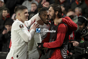 2024-02-22 - Rafael Leao of AC Milan celebrates his goal with Luka Jovic, Yacine Adli during the UEFA Europa League, Play-off 2nd leg football match between Stade Rennais (Rennes) and AC Milan on February 22, 2024 at Roazhon Park in Rennes, France - FOOTBALL - EUROPA LEAGUE - RENNES V MILAN - UEFA EUROPA LEAGUE - SOCCER