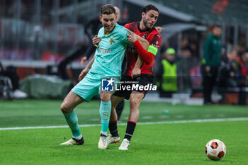 2024-03-07 - Davide Calabria of AC Milan competes for the ball with Lukas Provod of SK Slavia Praha during UEFA Europa League 2023/24 Round of 16 - 1st  leg football match between AC Milan and SK Slavia Praha at San Siro Stadium, Milan, Italy on March 07, 2024 - MILAN VS SLAVIA PRAHA - UEFA EUROPA LEAGUE - SOCCER