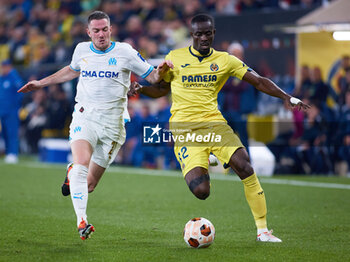 2024-03-14 - Eric Bailly (R) of Villarreal competes for the ball with Jordan Veretout of Olympique de Marseille during the UEFA Europa League, Round of 16, 2nd leg football match between Villarreal CF and Olympique de Marseille on March 14, 2024 at Estadio de la Ceramica in Villarreal, Spain - FOOTBALL - EUROPA LEAGUE - VILLARREAL V MARSEILLE - UEFA EUROPA LEAGUE - SOCCER