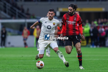 2024-04-11 - Lorenzo Pellegrini of AS Roma competes for the ball with Yacine Adli of AC Milan during UEFA Europa League 2023/24 Quarter Finals - 1st  leg football match between AC Milan and AS Roma at San Siro Stadium, Milan, Italy on April 11, 2024 - AC MILAN VS AS ROMA - UEFA EUROPA LEAGUE - SOCCER