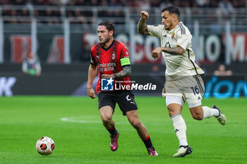 2024-04-11 - Davide Calabria of AC Milan (L) seen in action with Leandro Paredes of AS Roma (R) during UEFA Europa League 2023/24 Quarter Finals - 1st  leg football match between AC Milan and AS Roma at San Siro Stadium, Milan, Italy on April 11, 2024 - AC MILAN VS AS ROMA - UEFA EUROPA LEAGUE - SOCCER