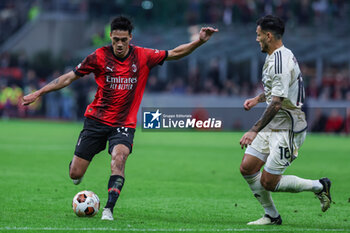 2024-04-11 - Tijjani Reijnders of AC Milan (L) seen in action with Leandro Paredes of AS Roma (R) during UEFA Europa League 2023/24 Quarter Finals - 1st  leg football match between AC Milan and AS Roma at San Siro Stadium, Milan, Italy on April 11, 2024 - AC MILAN VS AS ROMA - UEFA EUROPA LEAGUE - SOCCER