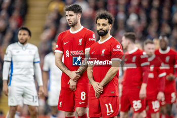 2024-04-11 - Liverpool midfielder Dominik Szoboszlai (8) and Liverpool forward Mohamed Salah (11) form a wall during the UEFA Europa League, Quarter-finals, 1st leg football match between Liverpool and Atalanta on 11 April 2024 at Anfield stadium in Liverpool, England - FOOTBALL - EUROPA LEAGUE - LIVERPOOL V ATALANTA - UEFA EUROPA LEAGUE - SOCCER
