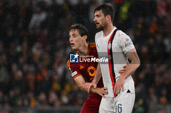 2024-04-18 - Edoardo Bove of A.S. Roma and Matteo Gabbia A.C. Milan during the UEFA Europa League Quarter-final second Leg match, between A.S. Roma vs A.C. Milan at the Olympic Stadium on April 18, 2024 in Rome, Italy. - AS ROMA VS AC MILAN - UEFA EUROPA LEAGUE - SOCCER