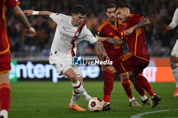 2024-04-18 - Christian Pulisic of A.C. Milan and Leandro Paredes of A.S. Roma during the UEFA Europa League Quarter-final second Leg match, between A.S. Roma vs A.C. Milan at the Olympic Stadium on April 18, 2024 in Rome, Italy. - AS ROMA VS AC MILAN - UEFA EUROPA LEAGUE - SOCCER