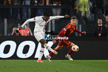 2024-04-18 - Rafael Leao of A.C. Milan and Diego Llorente of A.S. Roma during the UEFA Europa League Quarter-final second Leg match, between A.S. Roma vs A.C. Milan at the Olympic Stadium on April 18, 2024 in Rome, Italy. - AS ROMA VS AC MILAN - UEFA EUROPA LEAGUE - SOCCER