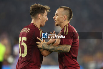 2024-09-26 - Rome, Italy 26.9.2024: Tommaso Baldanzi of Roma, Angelino of Roma score the goal and celebrate with the team during the UEFA Europa League 2024-2025 day 1, football match between AS Roma vs Athletic Club Bilbao at Olympic Stadium in Rome. - AS ROMA VS ATHLETIC BILBAO - UEFA EUROPA LEAGUE - SOCCER