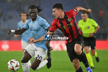 2024-10-03 - Loum Tchaouna of S.S. Lazio and Tom Louchet of O.G.C. Nice in action during the UEFA Europa League 2024/25 League Phase MD2 match between S.S. Lazio and O.G.C. Nice at Olympic Stadium on October 3, 2024 in Rome, Italy. - SS LAZIO VS OGC NICE - UEFA EUROPA LEAGUE - SOCCER