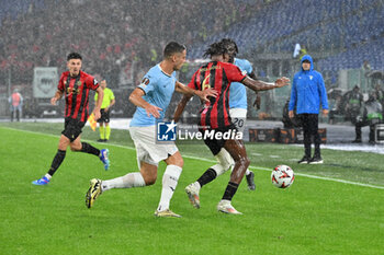 2024-10-03 - Adam Marusic of S.S. Lazio and Hicham Boudaoui of O.G.C. Nice in action during the UEFA Europa League 2024/25 League Phase MD2 match between S.S. Lazio and O.G.C. Nice at Olympic Stadium on October 3, 2024 in Rome, Italy. - SS LAZIO VS OGC NICE - UEFA EUROPA LEAGUE - SOCCER