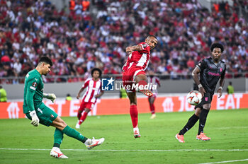 2024-10-03 - 9 Ayoub El Kaabi of Olympiacos FC competing with 1 Matheus of SC Braga during the Europa League, Matchday 2 match between Olympiacos FC and SC Braga at Georgios Karaiskakis Stadium on October 3, 2024, in Piraeus, Greece. - OLYMPIACOS FC VS SC BRAGA - UEFA EUROPA LEAGUE - SOCCER