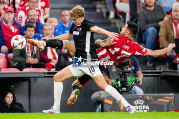 2024-10-03 - Sven Mijnans of AZ Alkmaar battles for possession with Yuri Berchiche of Athletic Club during the UEFA Europa League, League Phase, Matchday 2 football match between Athletic Club and AZ Alkmaar on October 3, 2024 at Estadio de San Mamés in Bilbao, Spain - FOOTBALL - EUROPA LEAGUE - ATHLETIC CLUB V AZ ALKMAAR - UEFA EUROPA LEAGUE - SOCCER