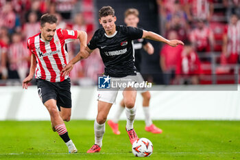 2024-10-03 - Andoni Gorosabel of Athletic Club battles for possession with Ruben van Bommel of AZ Alkmaar during the UEFA Europa League, League Phase, Matchday 2 football match between Athletic Club and AZ Alkmaar on October 3, 2024 at Estadio de San Mamés in Bilbao, Spain - FOOTBALL - EUROPA LEAGUE - ATHLETIC CLUB V AZ ALKMAAR - UEFA EUROPA LEAGUE - SOCCER