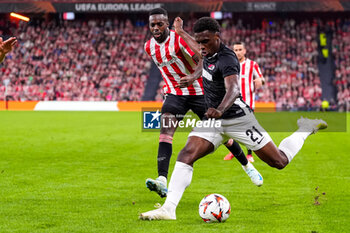 2024-10-03 - Inaki Williams of Athletic Club battles for possession with Ernest Poku of AZ Alkmaar during the UEFA Europa League, League Phase, Matchday 2 football match between Athletic Club and AZ Alkmaar on October 3, 2024 at Estadio de San Mamés in Bilbao, Spain - FOOTBALL - EUROPA LEAGUE - ATHLETIC CLUB V AZ ALKMAAR - UEFA EUROPA LEAGUE - SOCCER